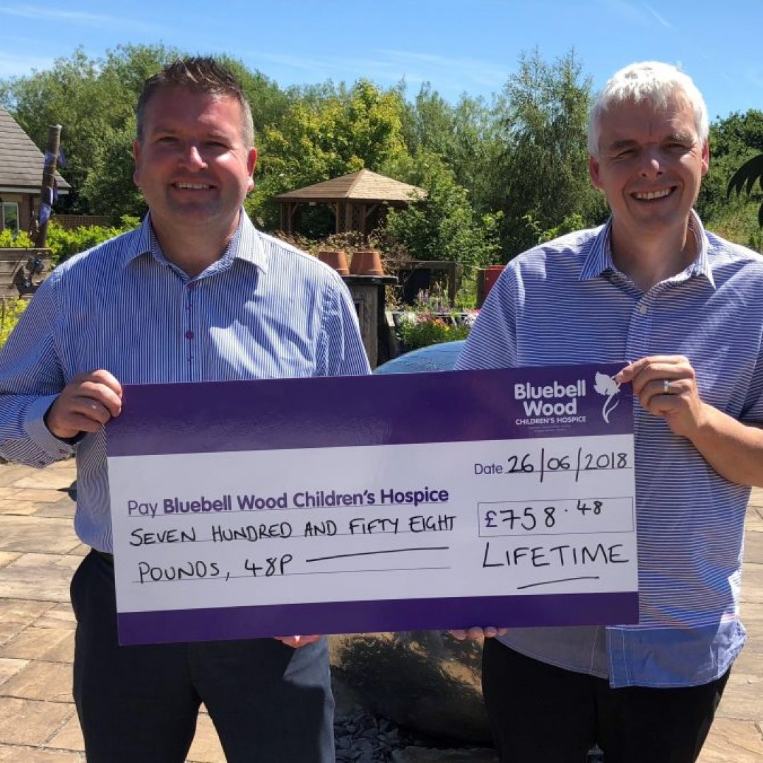 Lifetime Financial planner Paul Bassinder and Social Media Manager Andrew Lodge deliver a referral scheme donation to Bluebell Wood Children's Hospice.