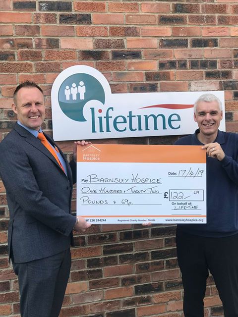 Lifetime Social Media Manager Andrew Lodge presents Barnsley Hospice fundraiser Simon Atkinson with a donation from Lifetime's successful referral scheme.