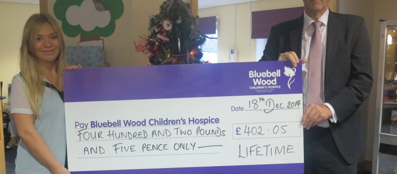 Financial Planner Colin a welcome guest with cheque for Bluebell Wood