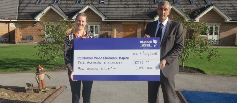Lifetime financial planner Colin presents Bluebell Wood with bumper cheque